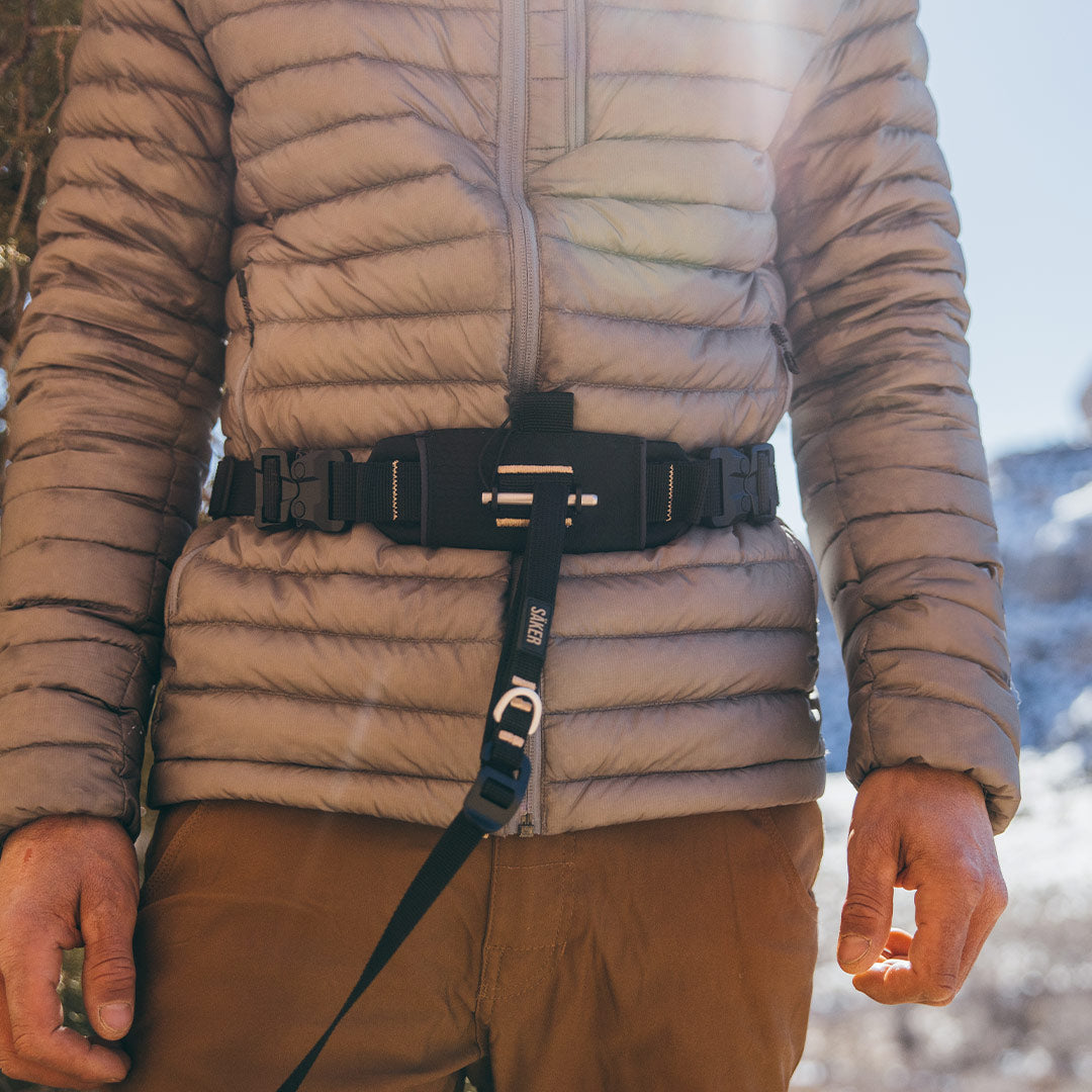 The canyon extension is used around the man's belly as a belt to attach leash