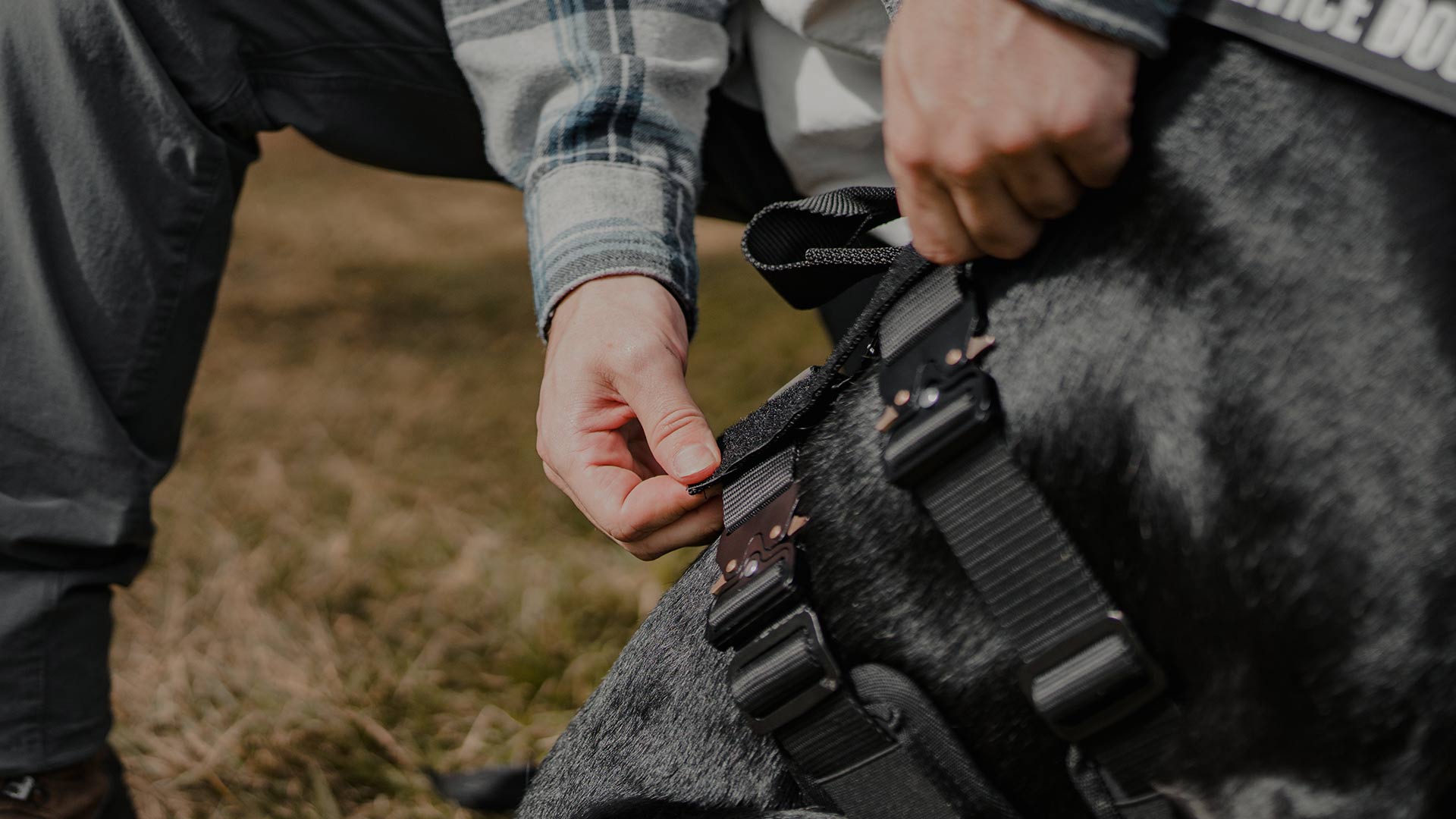 man installing the velcro sleeves onto the Ascension harness