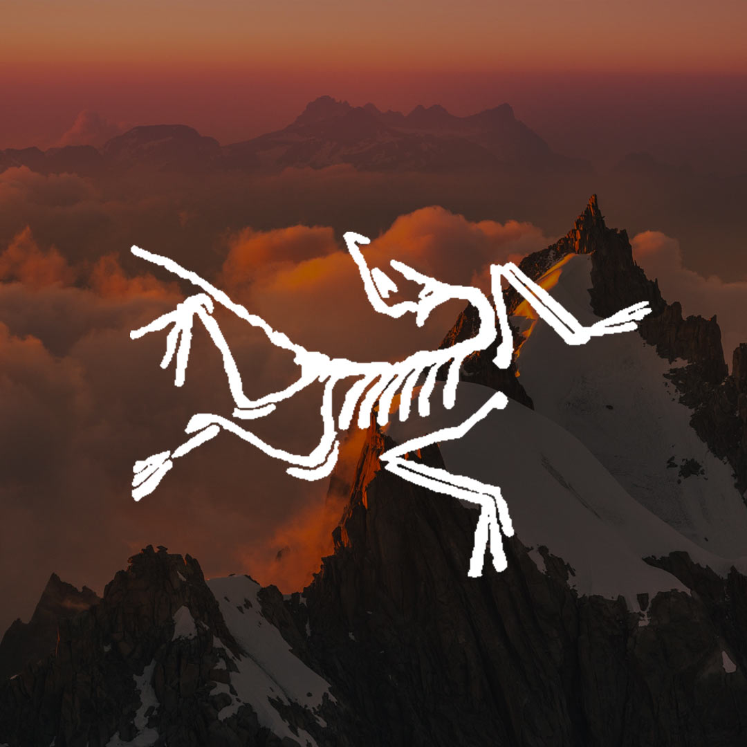 Arc'teryx logo with mountains in the back