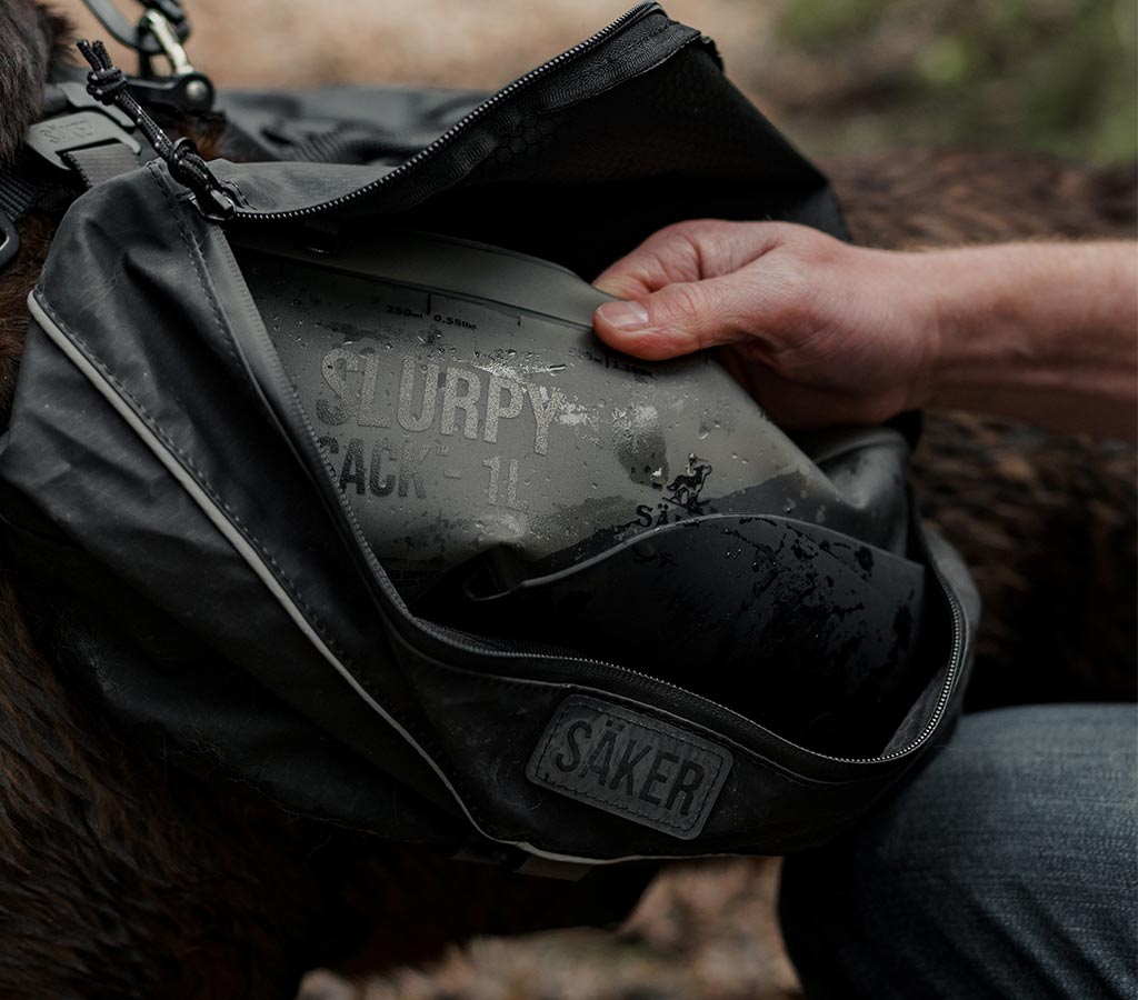 Packing the slurpy sack in the pouches of the Ascension dog pack