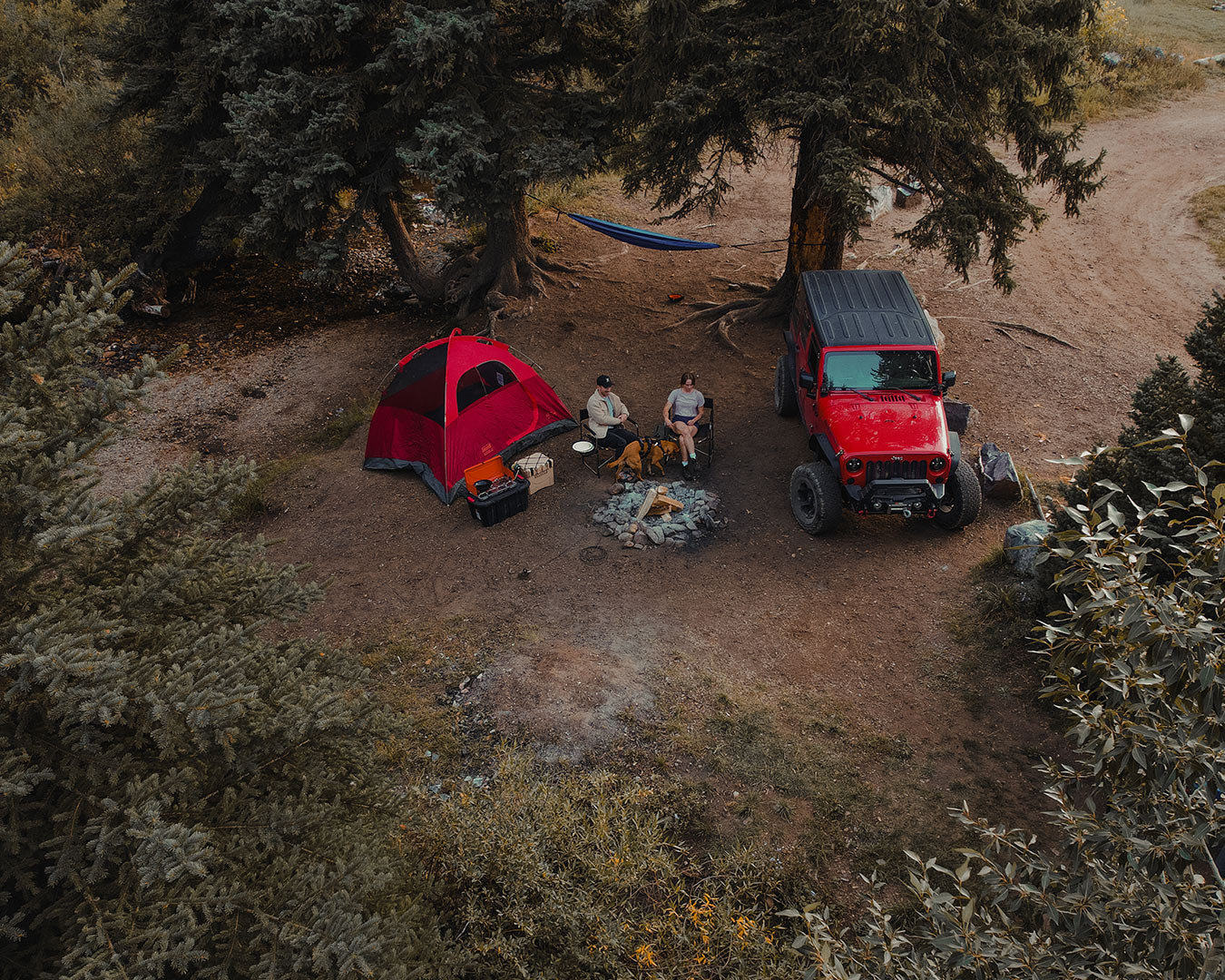 Bird view of a camping site with red jeep