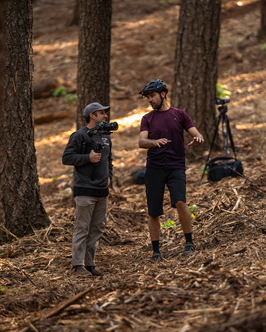 Filmmaker and Zach discussing the shoot in the trail